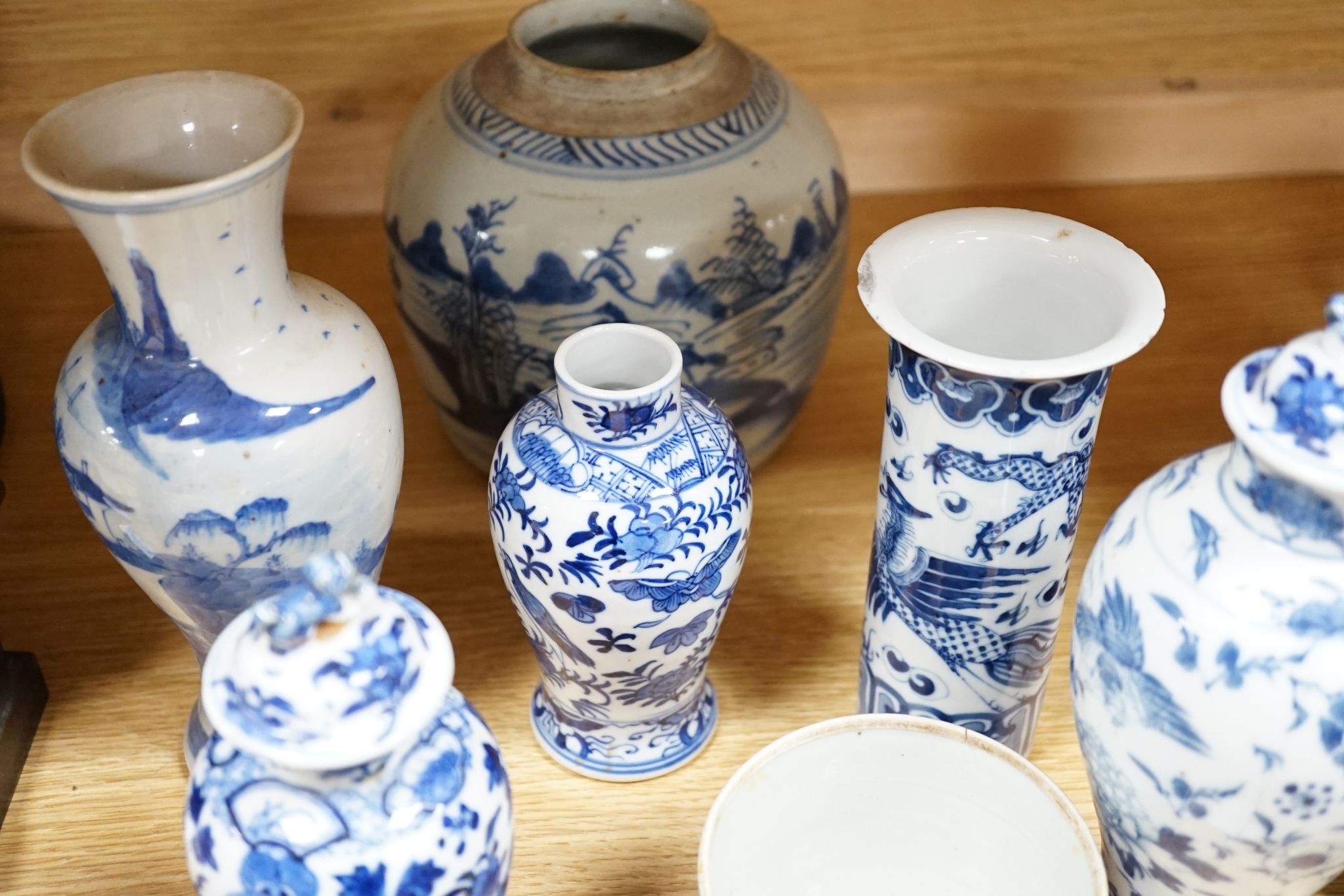 Twelve pieces of 19th century Chinese blue and white tableware and a small famille rose bowl, largest 20cm